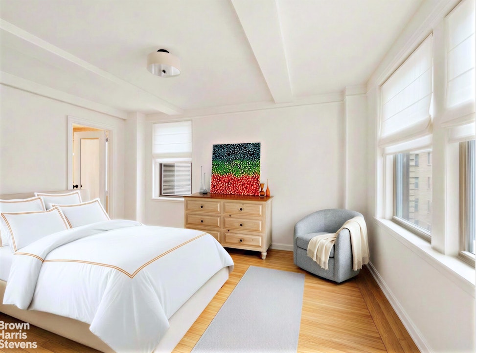 220 East 73rd Street, Unit 9H Manhattan, NY 10021 - Photo 5 of 15 a bedroom with a bed and wooden floor