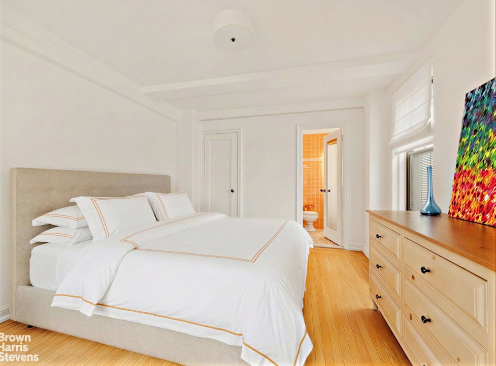 220 East 73rd Street, Unit 9H Manhattan, NY 10021 - Photo 6 of 15 a spacious bedroom with a bed and a dresser