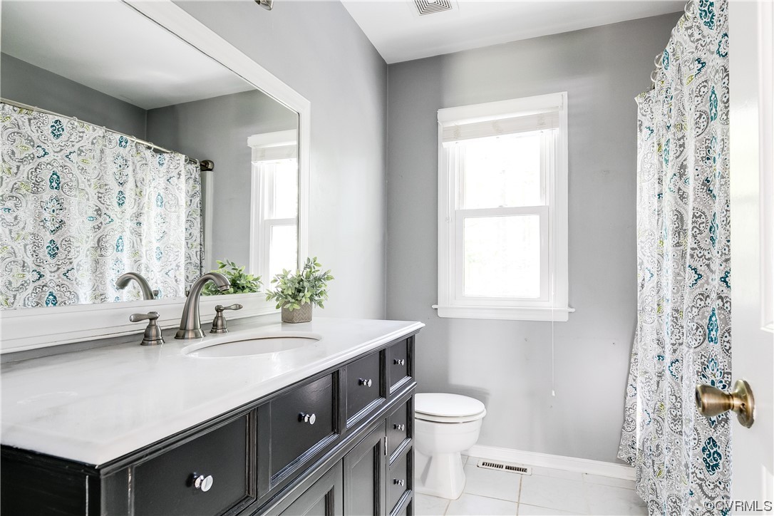 6007 Mill Spring Court Midlothian, VA 23112 - Photo 23 of 37 a bathroom with a sink a toilet and a window