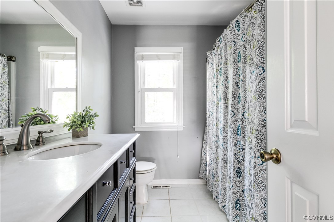 6007 Mill Spring Court Midlothian, VA 23112 - Photo 24 of 37 a bathroom with a sink a toilet and a window