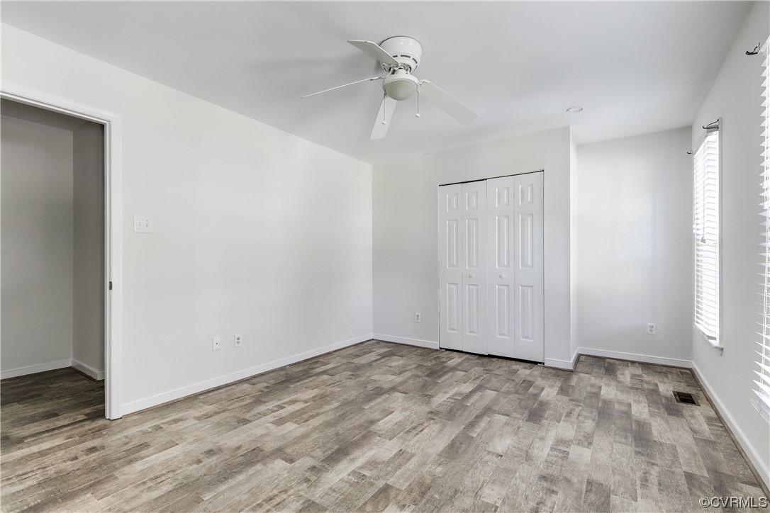 6007 Mill Spring Court Midlothian, VA 23112 - Photo 28 of 37 a view of empty room with wooden floor and ceiling fan
