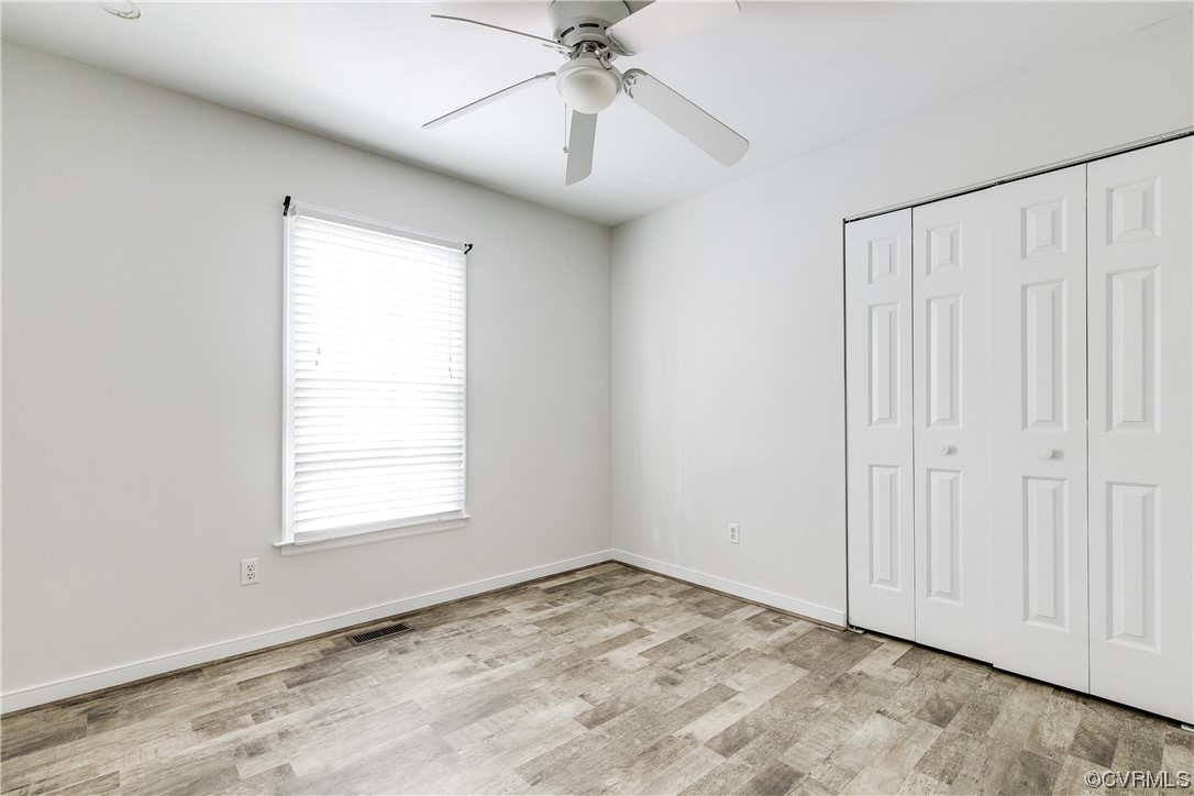 6007 Mill Spring Court Midlothian, VA 23112 - Photo 29 of 37 an empty room with a ceiling fan and a window