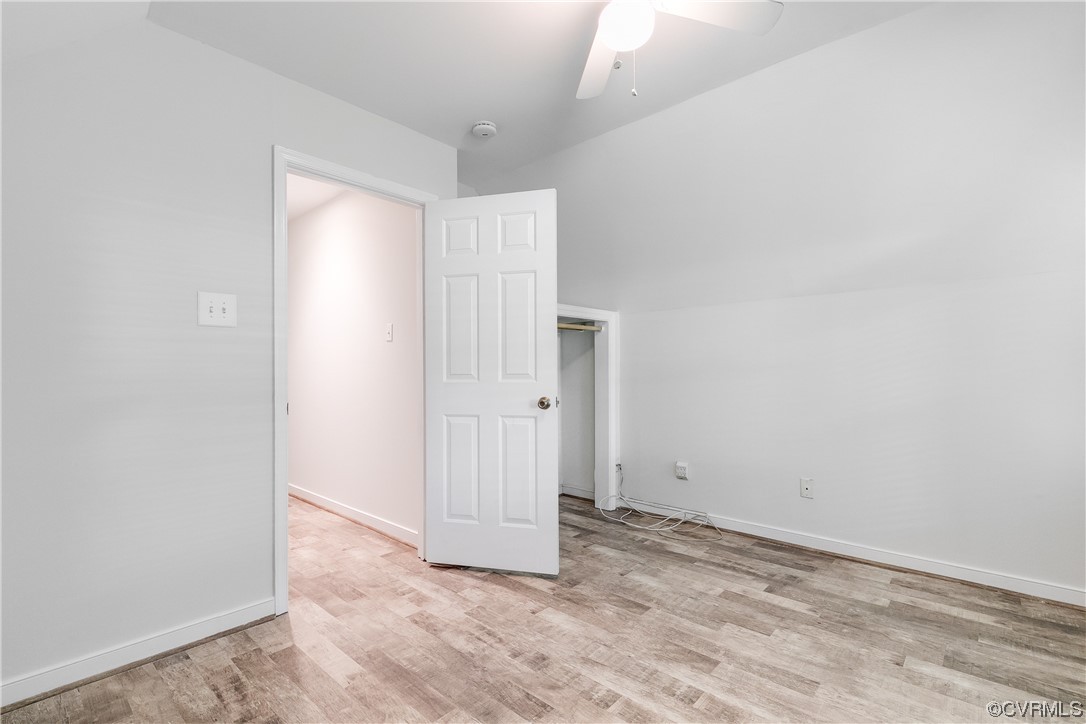6007 Mill Spring Court Midlothian, VA 23112 - Photo 32 of 37 an empty room with wooden floor and windows