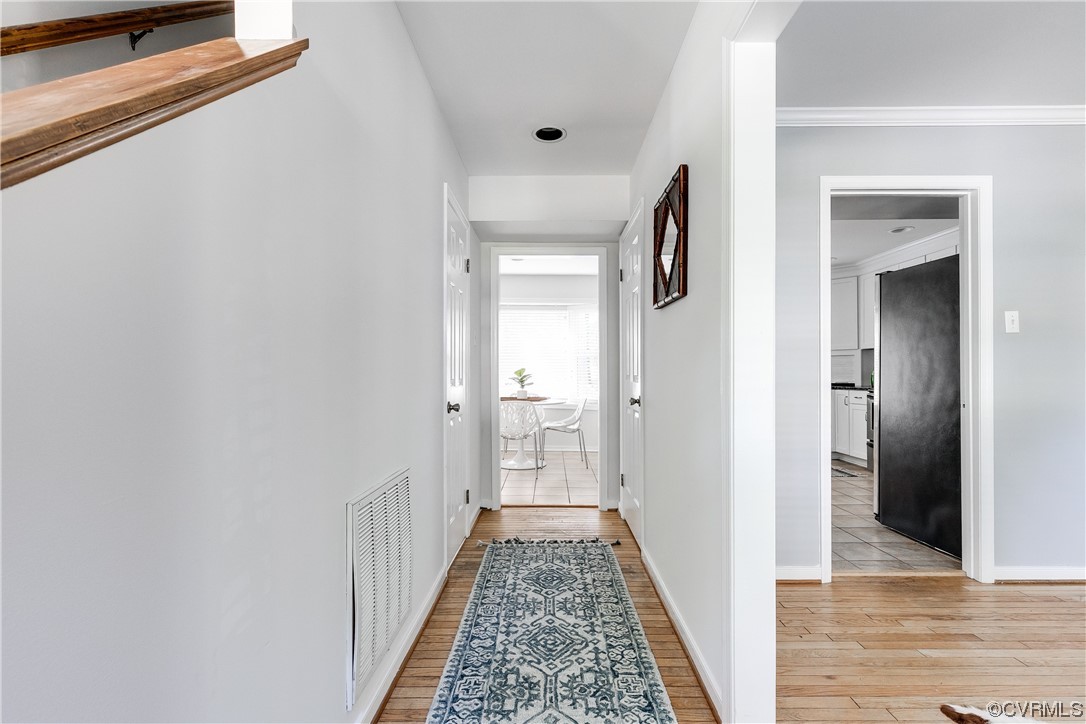 6007 Mill Spring Court Midlothian, VA 23112 - Photo 7 of 37 a view of a hallway with wooden floor and staircase