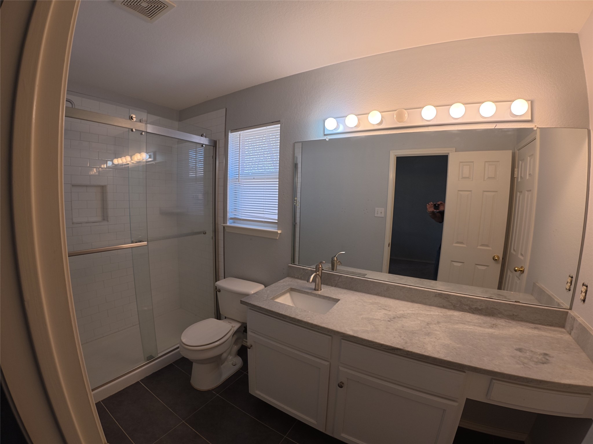 305 China Cove Elgin, TX 78621 - Photo 12 of 19 a bathroom with a sink a toilet and shower