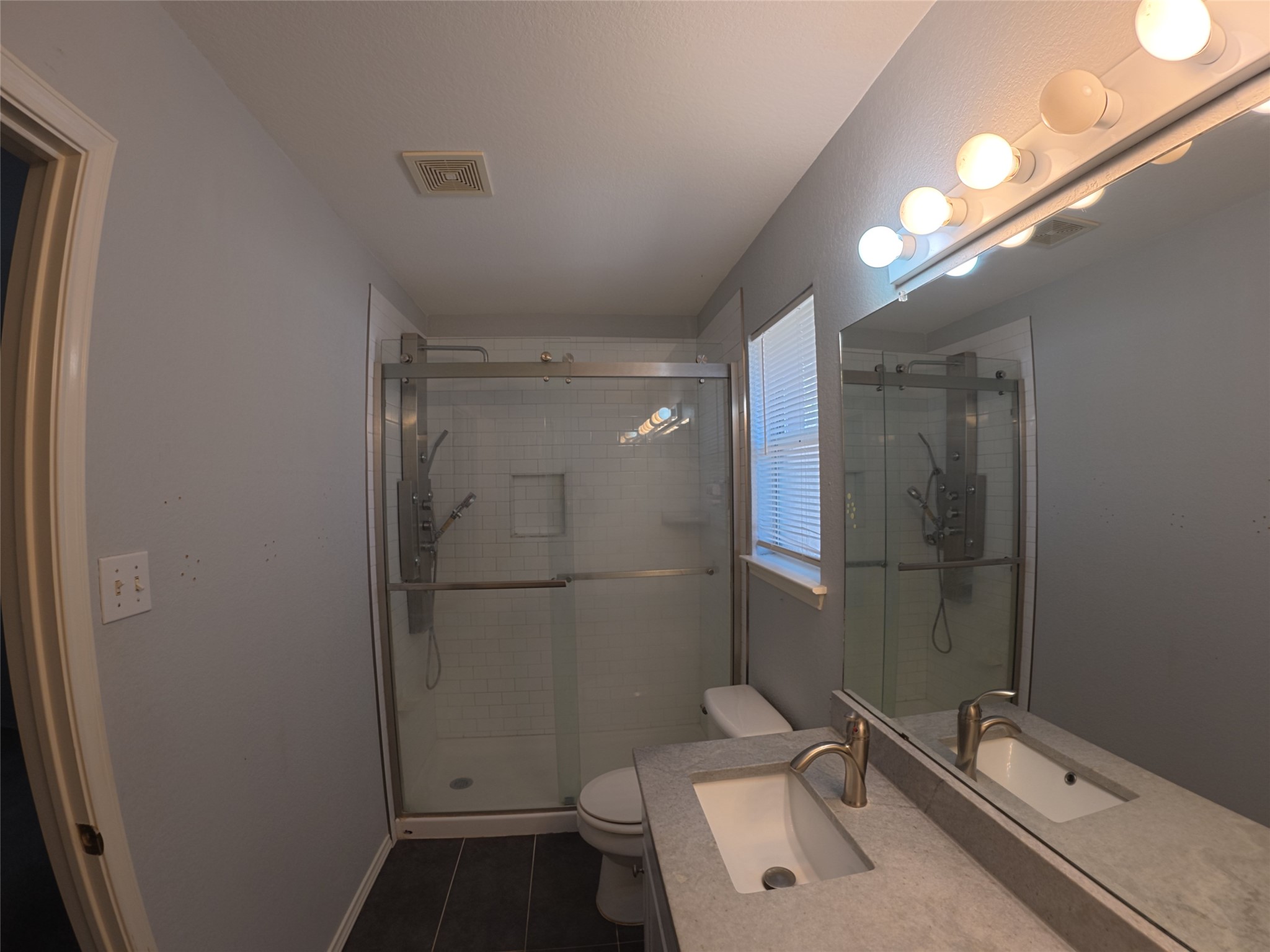 305 China Cove Elgin, TX 78621 - Photo 13 of 19 a bathroom with a sink and mirror