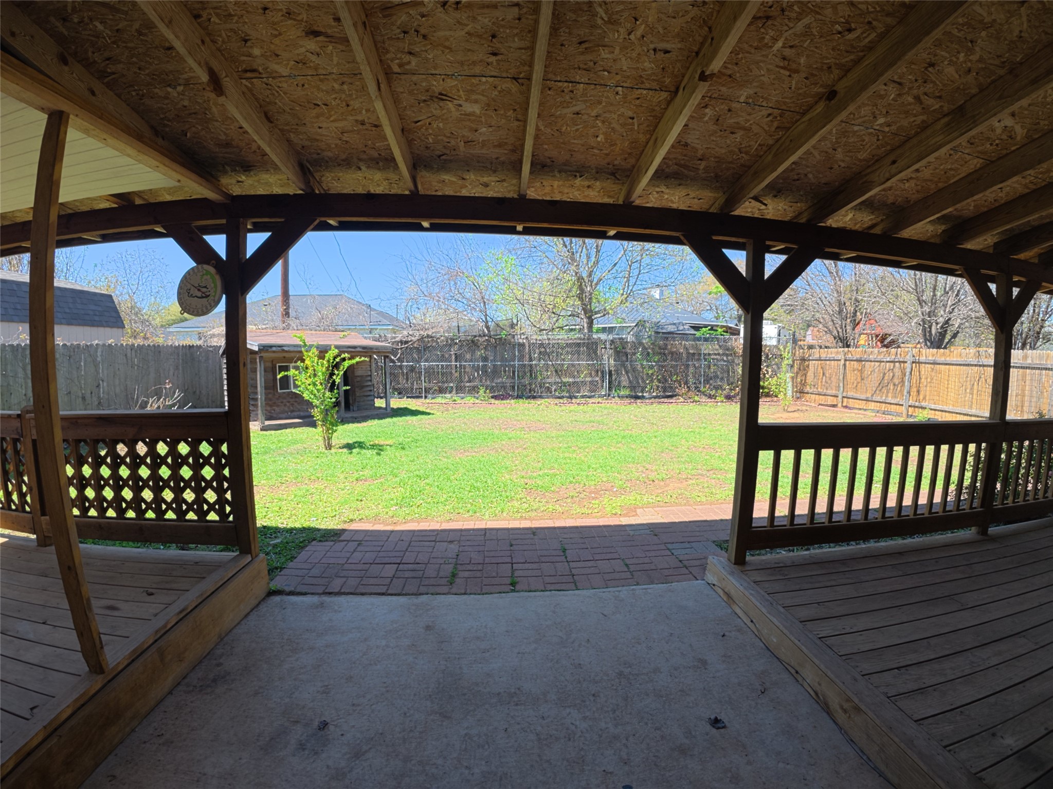 305 China Cove Elgin, TX 78621 - Photo 14 of 19 a view of a backyard with wooden floor and outdoor seating