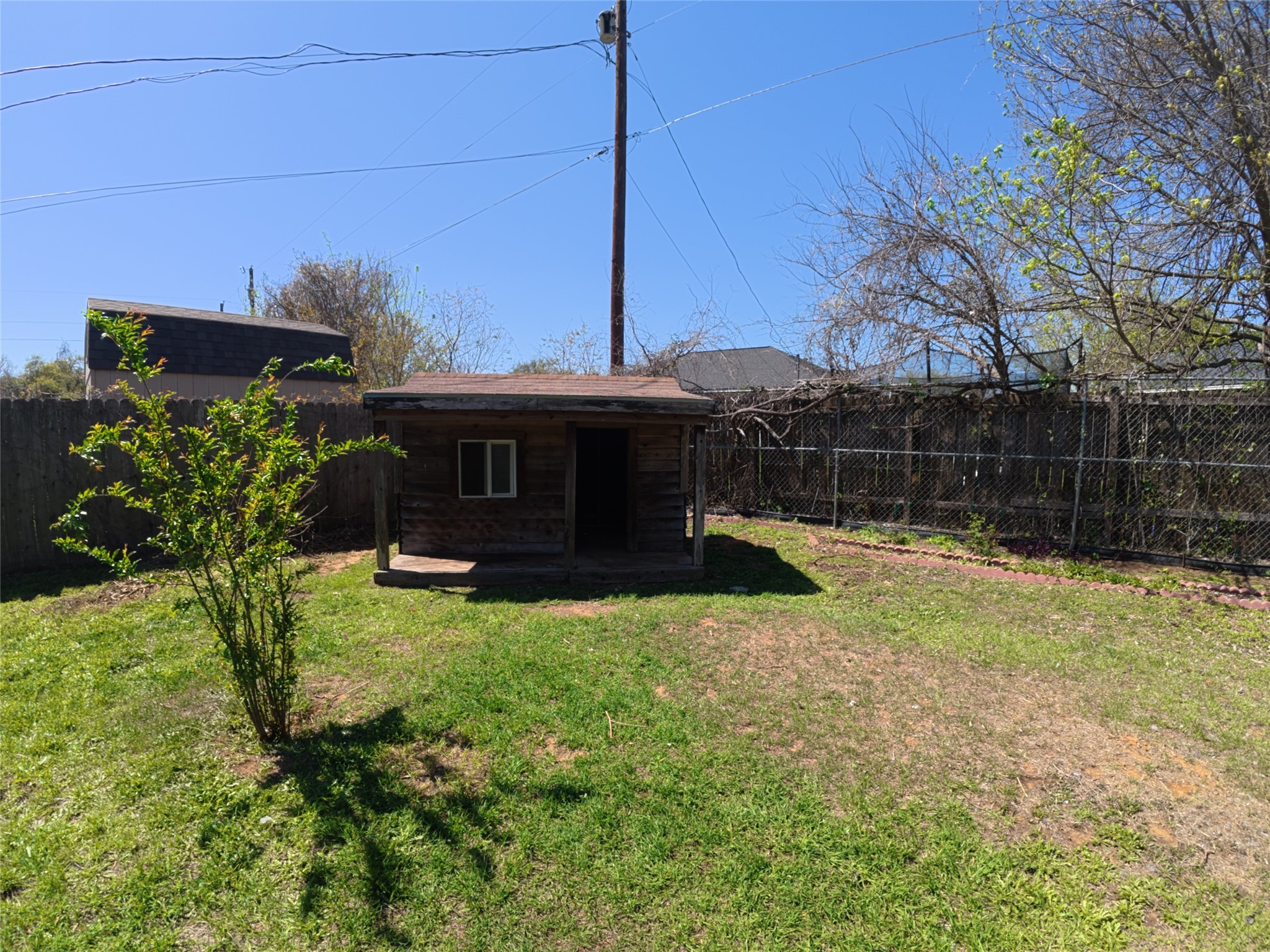 305 China Cove Elgin, TX 78621 - Photo 16 of 19 a view of a house with backyard and sitting area