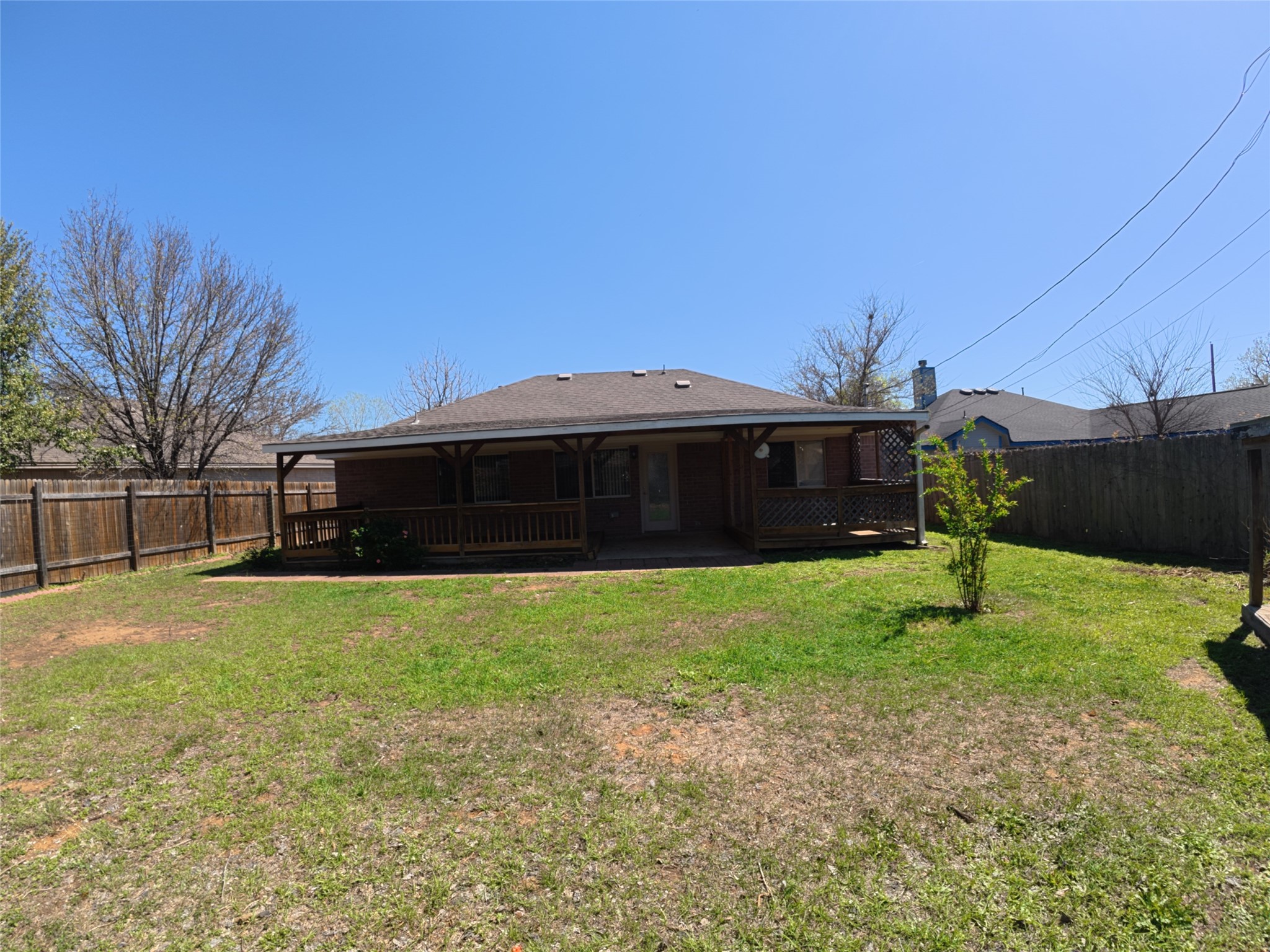 305 China Cove Elgin, TX 78621 - Photo 17 of 19 a front view of a house with a yard