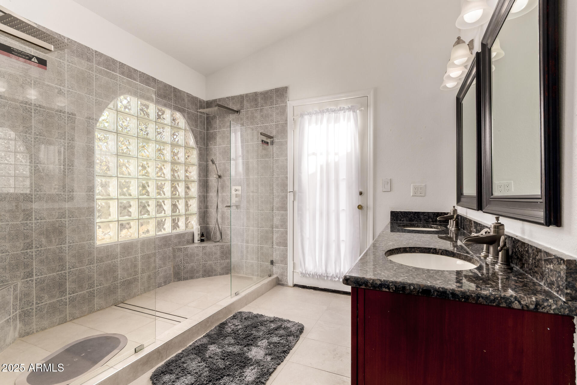 13613 South 37th Street Phoenix, AZ 85044 - Photo 27 of 63 a spacious bathroom with a sink mirror and a shower