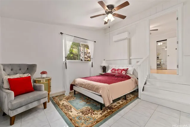 a bedroom with a bed and a couch