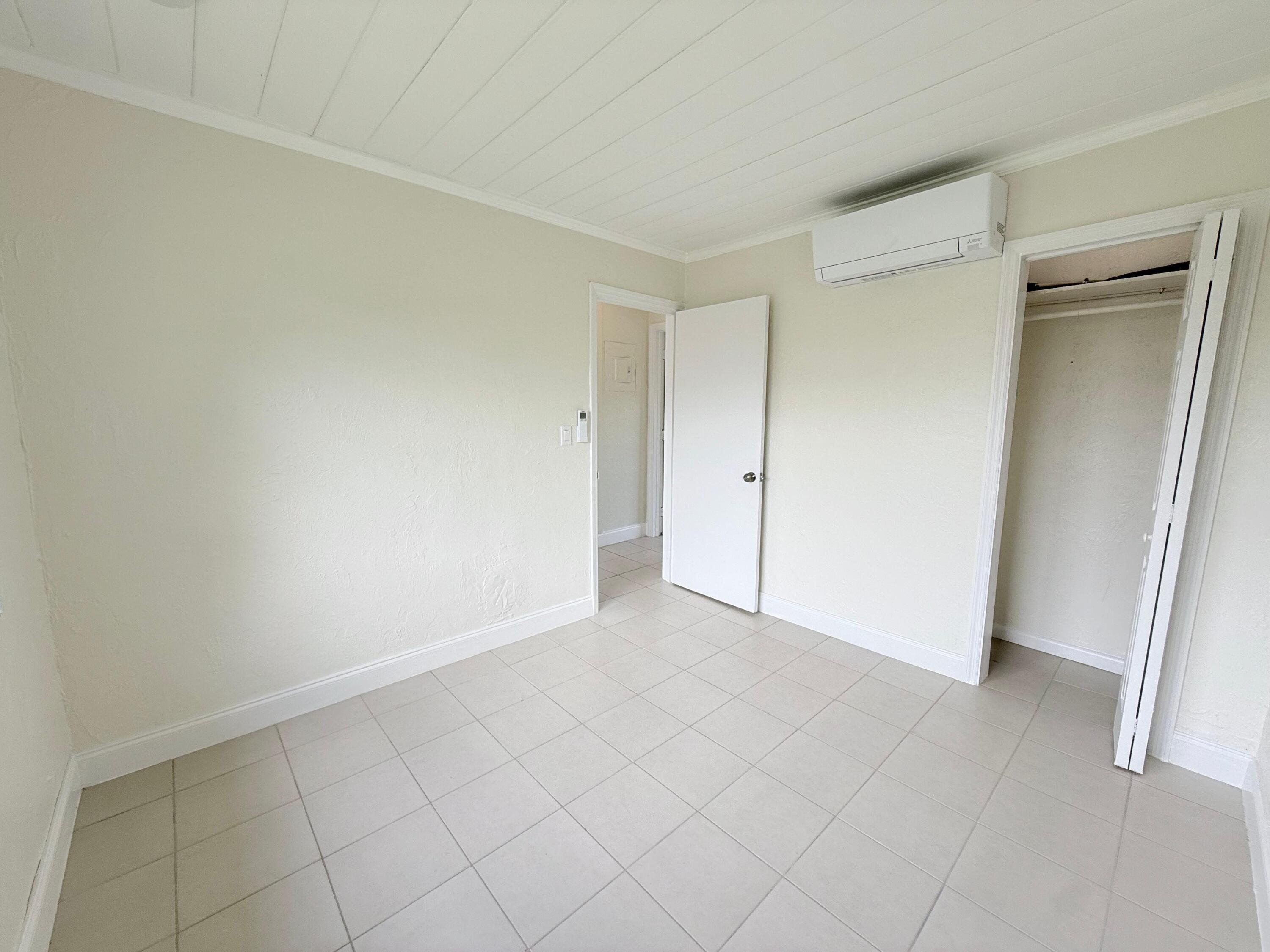 1409 West 33rd Street, Unit 1 Riviera Beach, FL 33404 - Photo 5 of 13 a view of an empty room