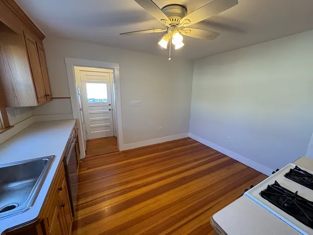 a view of room with wooden floor