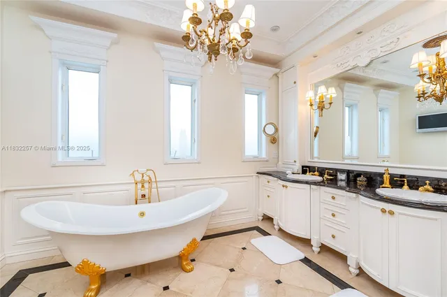 a bathroom with a tub sink and mirror