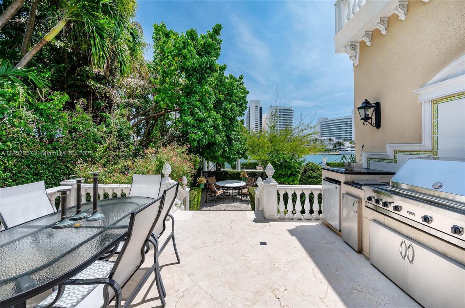 4539 Pine Tree Drive Miami Beach, FL 33140 - Photo 9 of 17 a view of a dining room with furniture and chandelier
