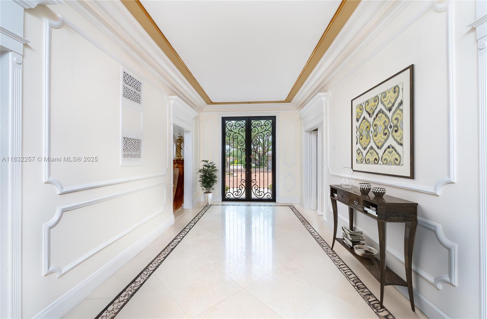 4539 Pine Tree Drive Miami Beach, FL 33140 - Photo 10 of 17 a view of a hallway with a large window