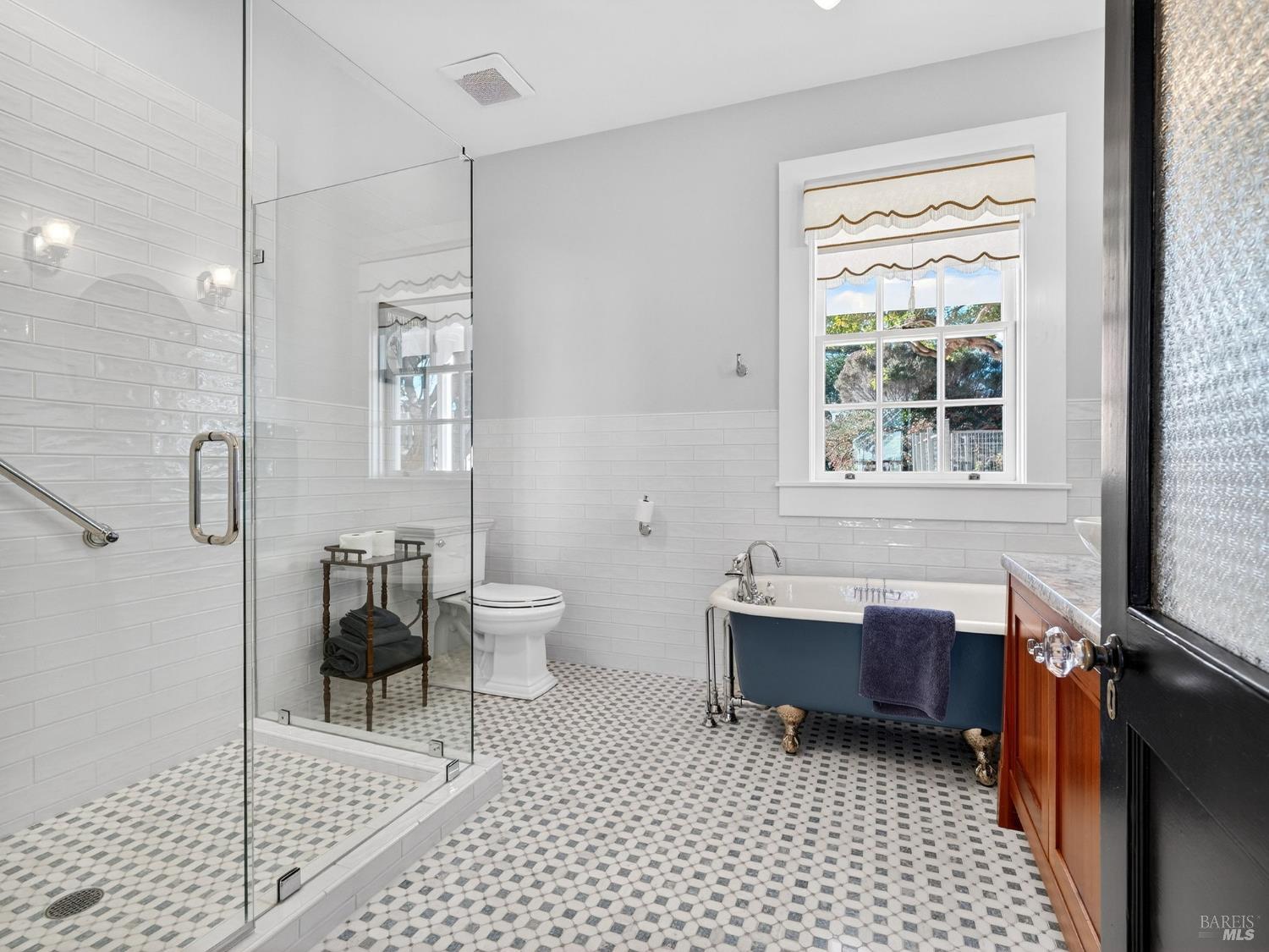 44900 Little Lake Road Mendocino, CA 95460 - Photo 22 of 54 A cast iron tub and walk in shower in the downstairs primary bathroom.