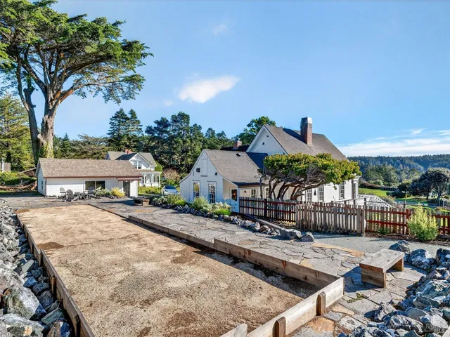 a view of a house with a yard and garage