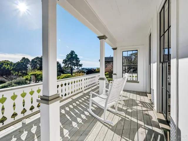 a view of balcony with wooden floor