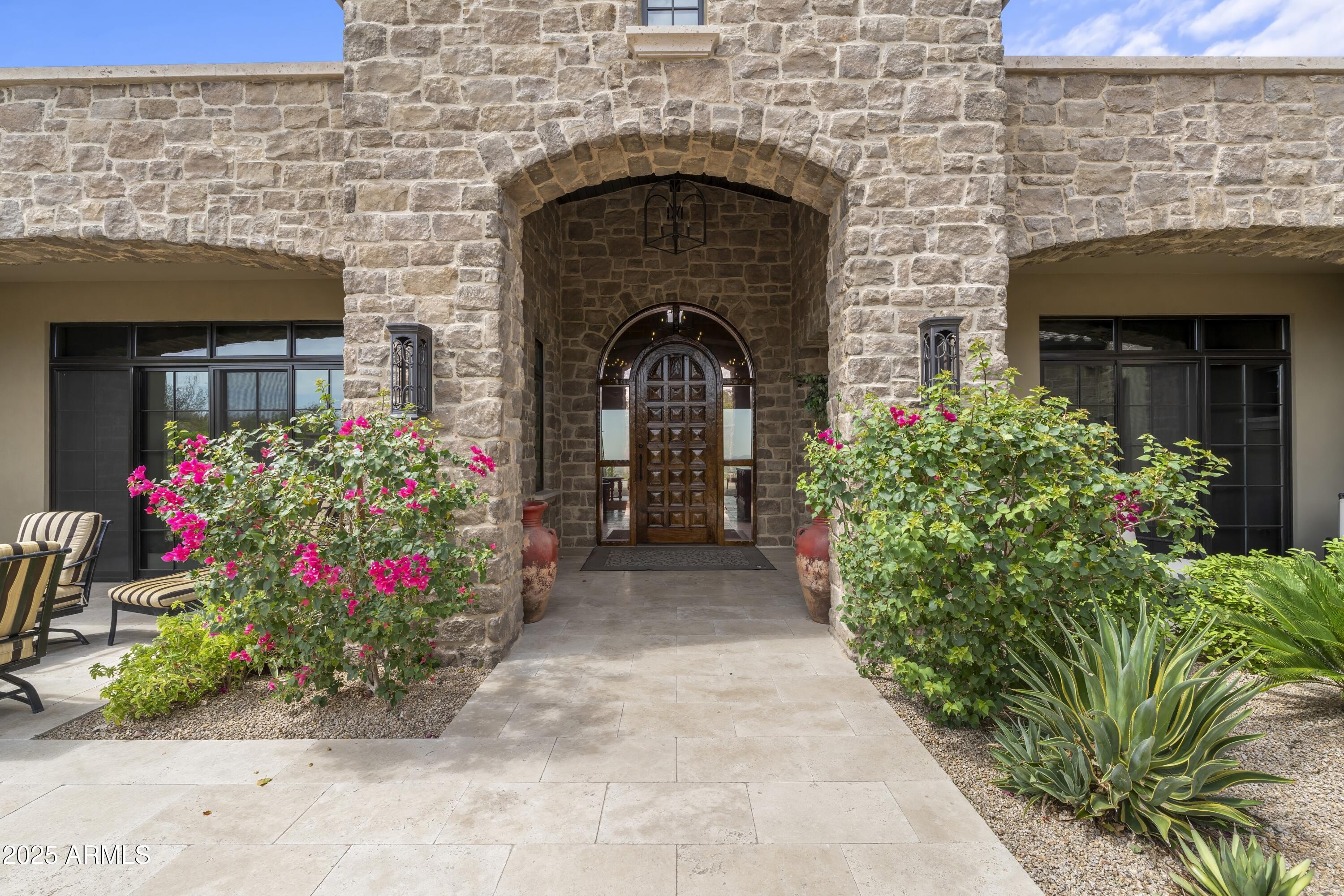 14699 East Paradise Drive, Unit 26 Scottsdale, AZ 85259 - Photo 18 of 73 a front view of a house with a pathway