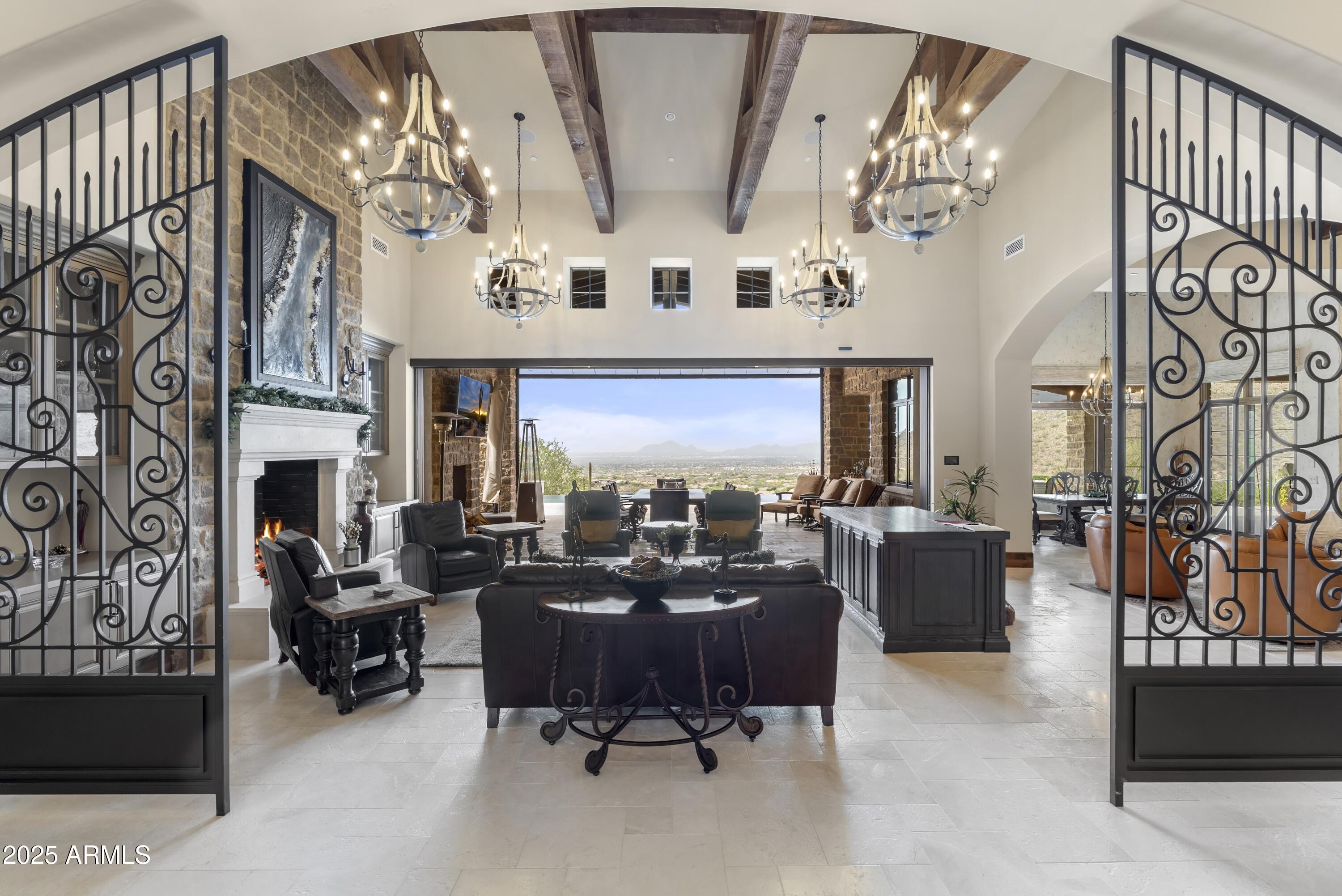 14699 East Paradise Drive, Unit 26 Scottsdale, AZ 85259 - Photo 25 of 73 a living room with fireplace furniture and a chandelier