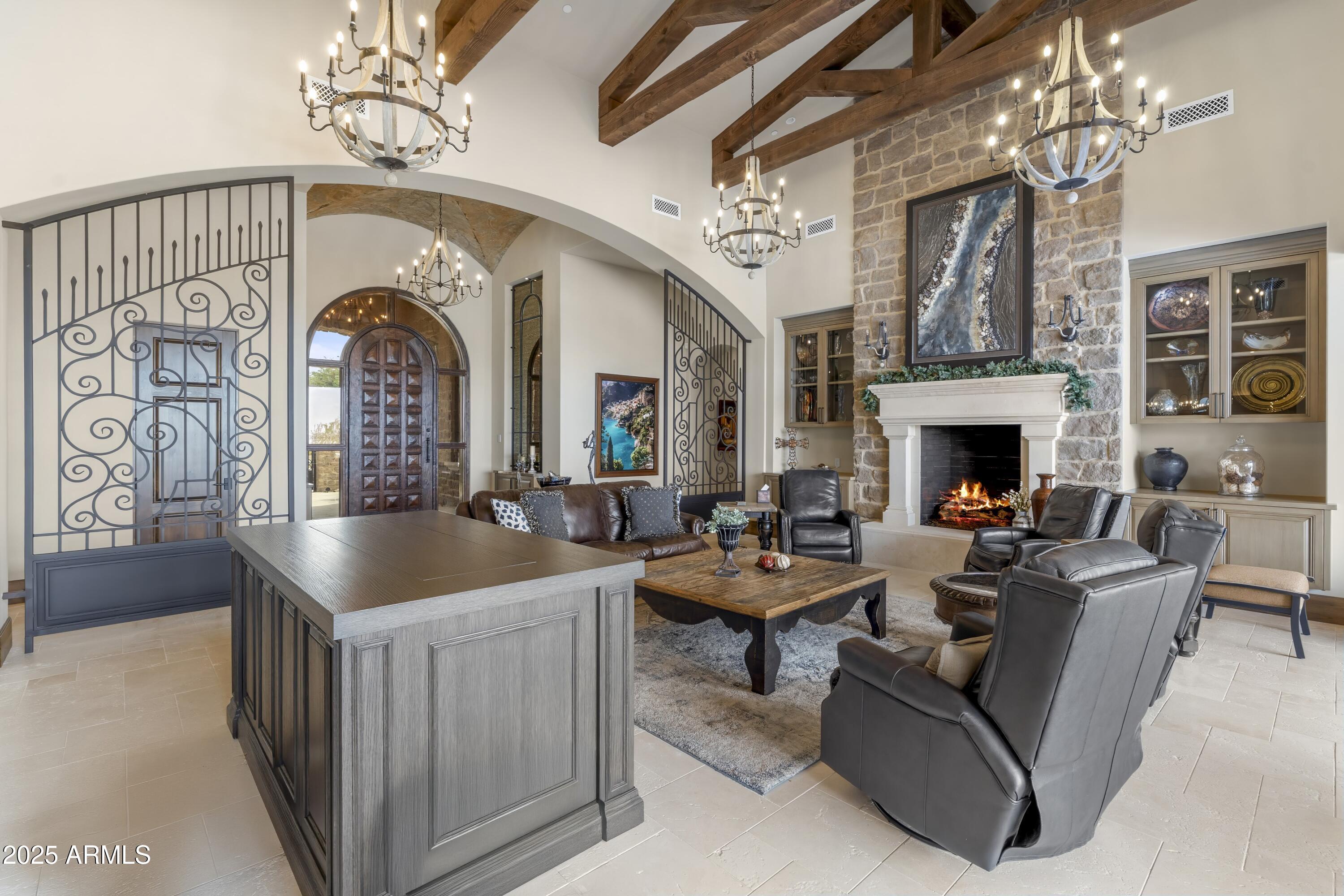 14699 East Paradise Drive, Unit 26 Scottsdale, AZ 85259 - Photo 26 of 73 a living room with fireplace furniture and a chandelier