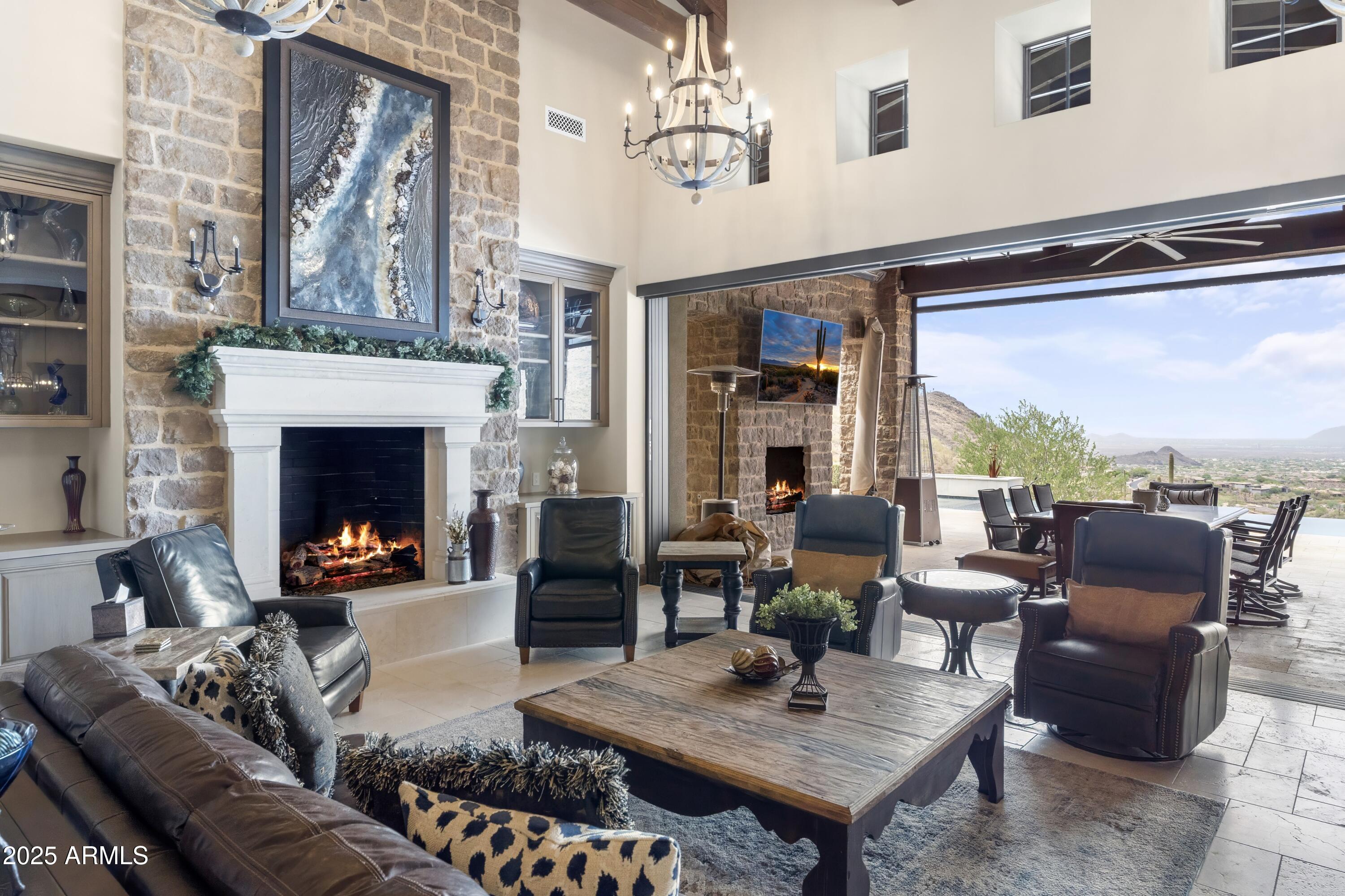 14699 East Paradise Drive, Unit 26 Scottsdale, AZ 85259 - Photo 28 of 73 a living room with furniture a fireplace and a flat screen tv