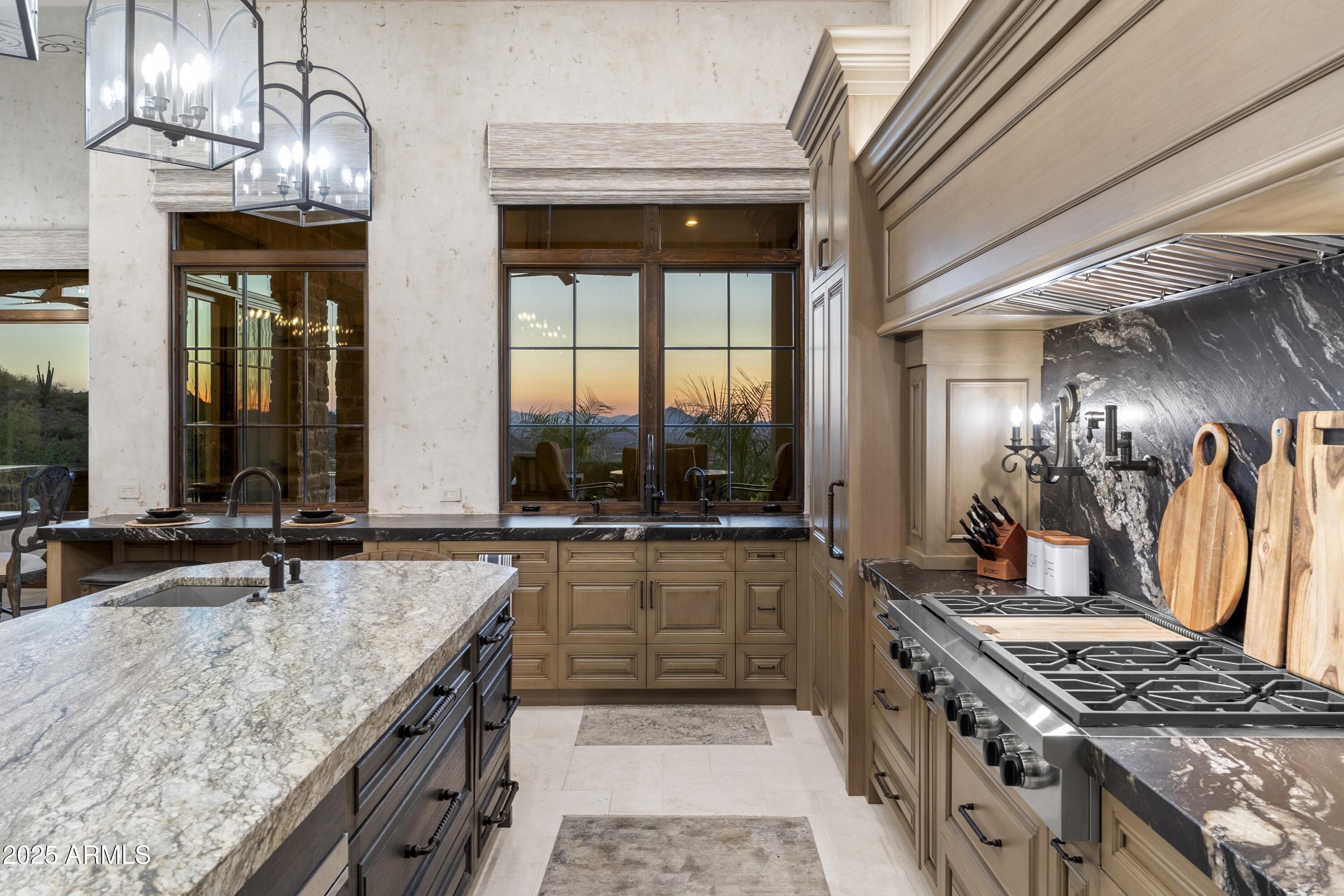 14699 East Paradise Drive, Unit 26 Scottsdale, AZ 85259 - Photo 40 of 73 a kitchen with a stove and a sink