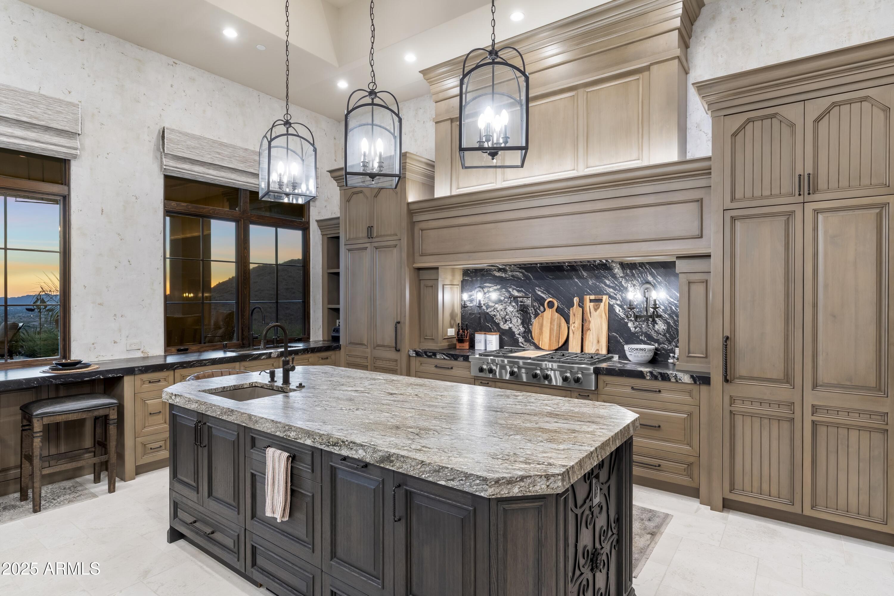 14699 East Paradise Drive, Unit 26 Scottsdale, AZ 85259 - Photo 43 of 73 a kitchen with stainless steel appliances granite countertop a sink and a refrigerator