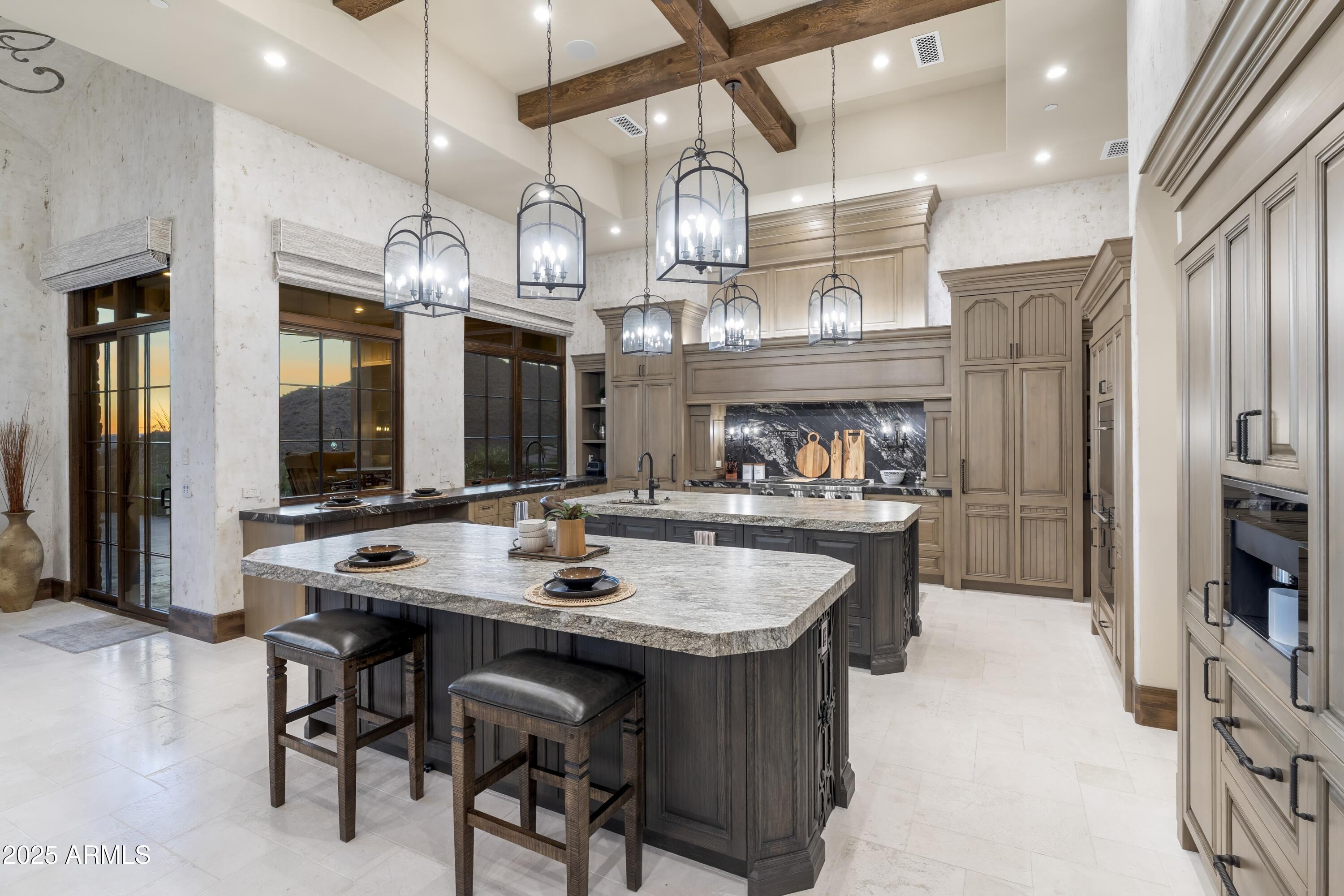 14699 East Paradise Drive, Unit 26 Scottsdale, AZ 85259 - Photo 44 of 73 a kitchen with a table and chairs in it