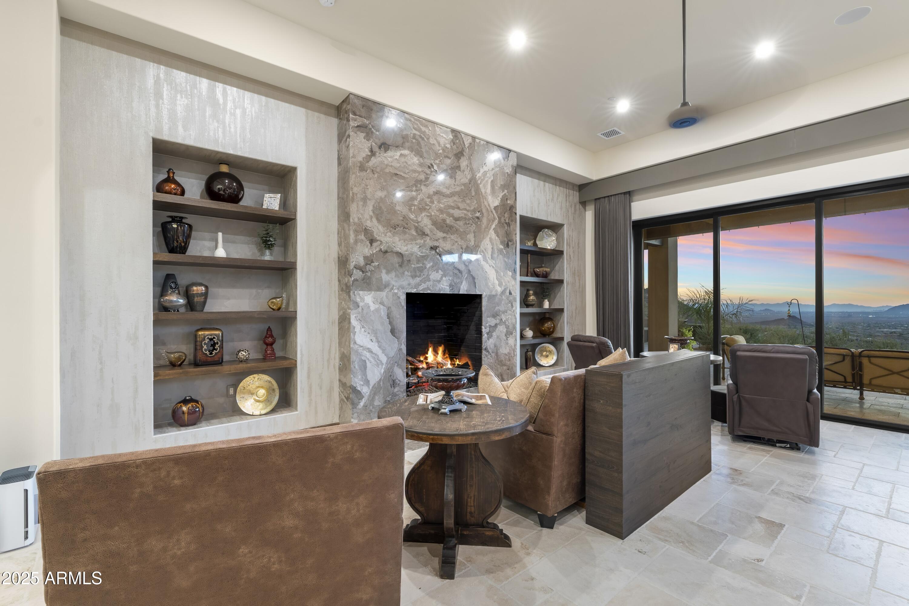 14699 East Paradise Drive, Unit 26 Scottsdale, AZ 85259 - Photo 51 of 73 a living room with furniture a flat screen tv and a floor to ceiling window