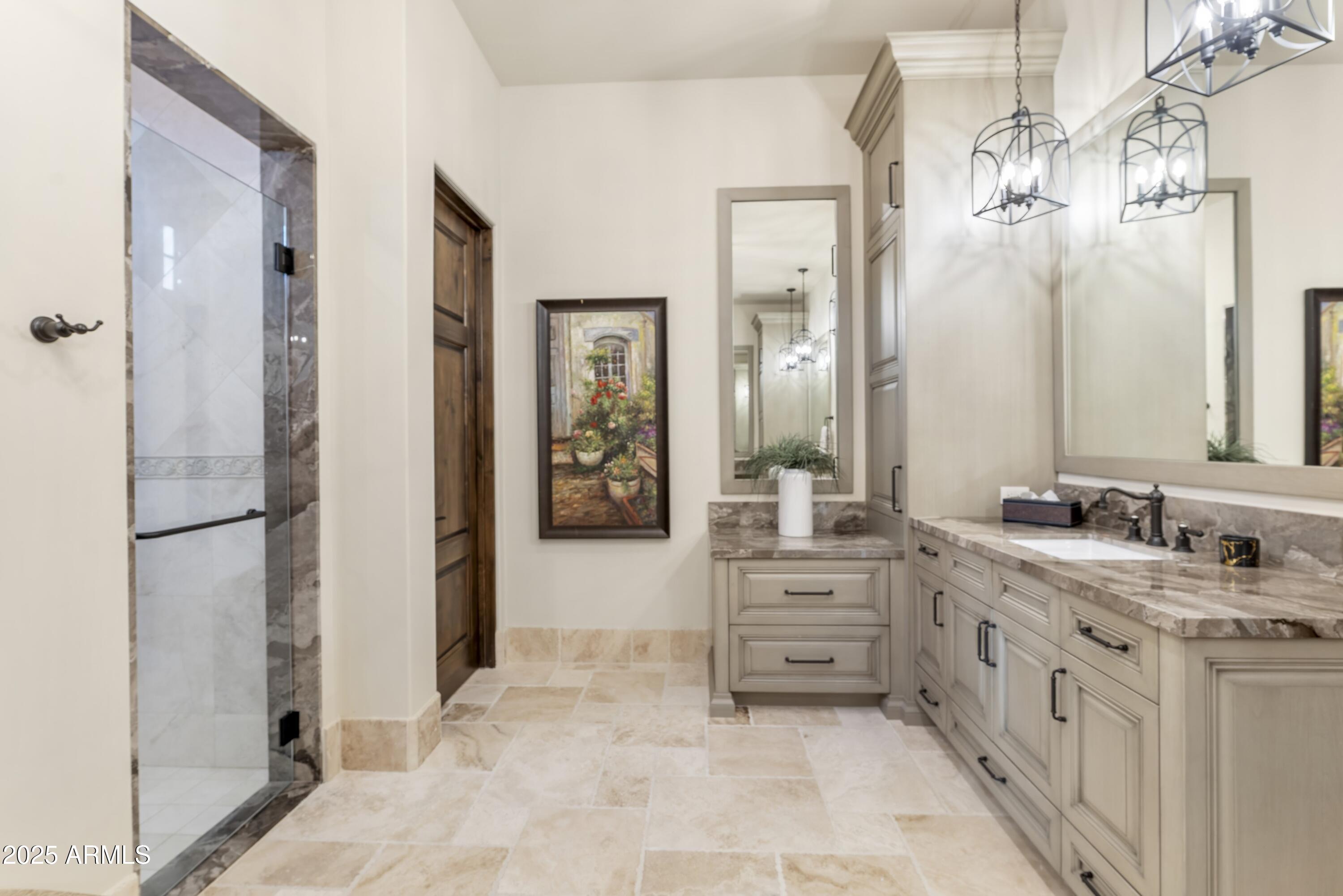 14699 East Paradise Drive, Unit 26 Scottsdale, AZ 85259 - Photo 60 of 73 a bathroom with a double vanity sink a mirror a bathtub and
