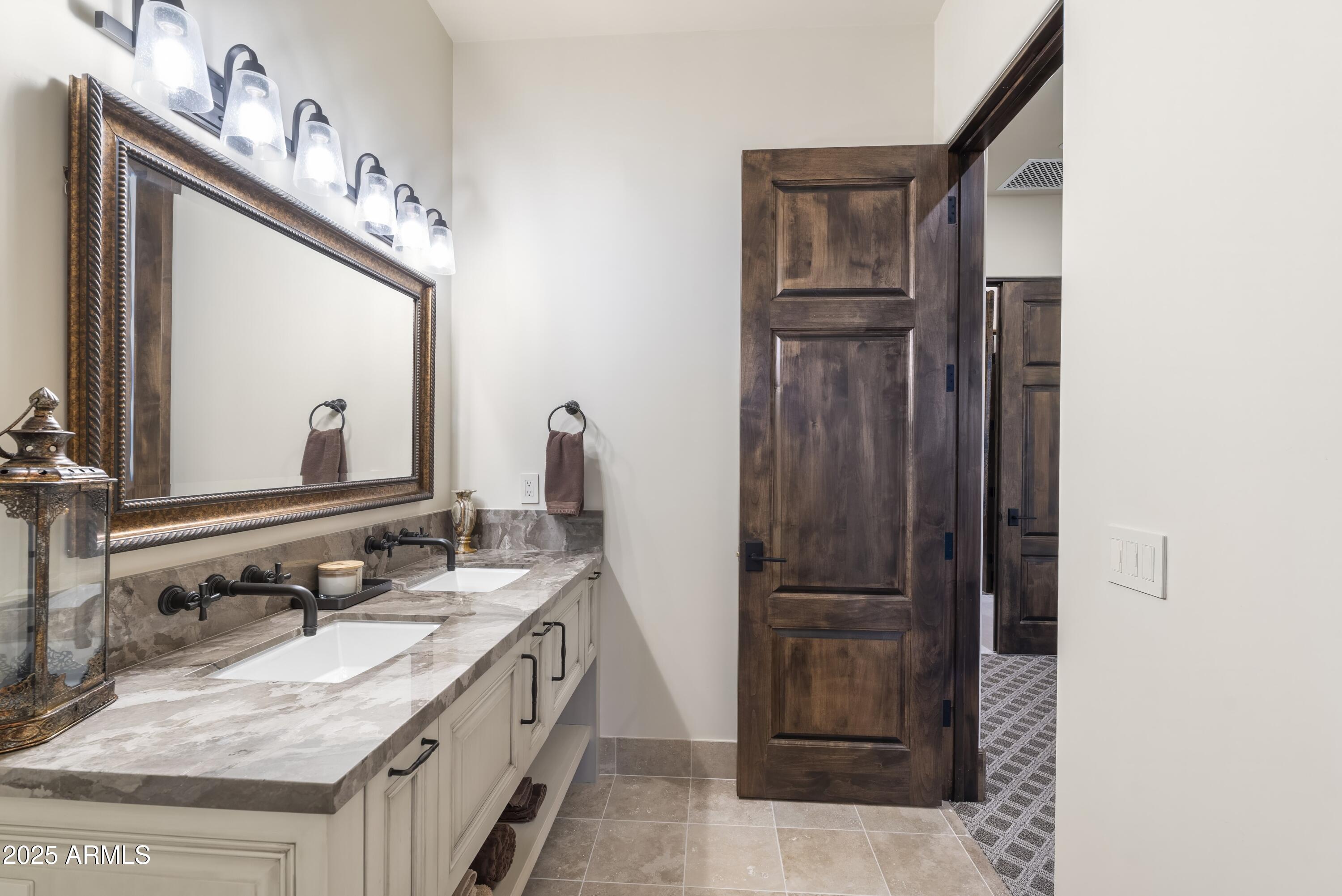 14699 East Paradise Drive, Unit 26 Scottsdale, AZ 85259 - Photo 67 of 73 a bathroom with a granite countertop sink vanity and mirror