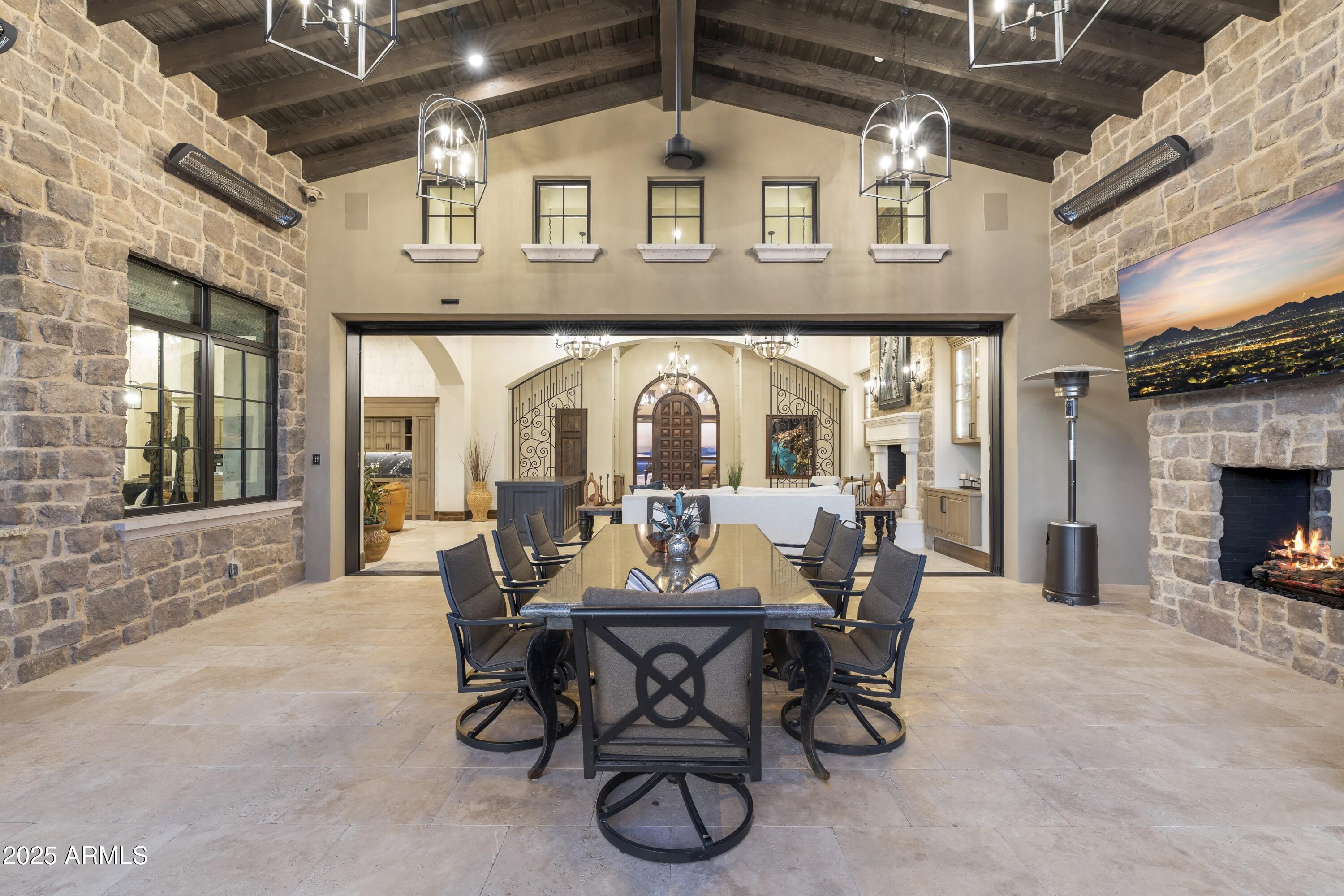 14699 East Paradise Drive, Unit 26 Scottsdale, AZ 85259 - Photo 9 of 73 a view of a patio with table and chairs
