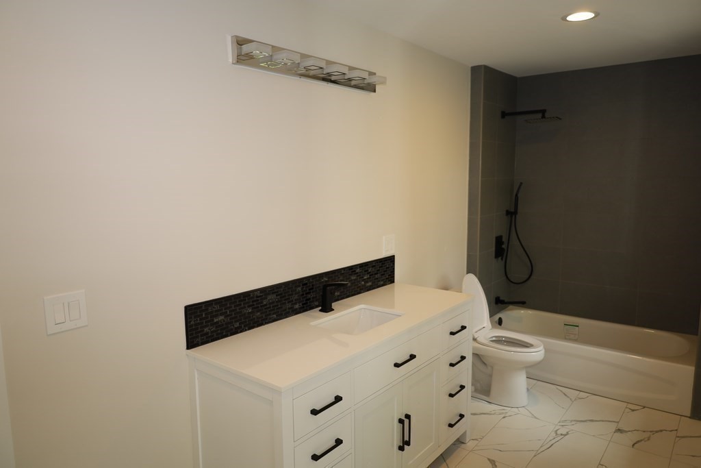 109 North Road Westfield, MA 01085 - Photo 31 of 41 a bathroom with a granite countertop sink toilet and shower