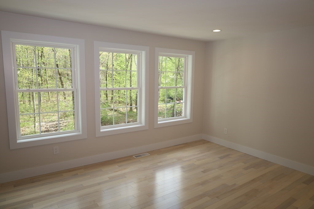 109 North Road Westfield, MA 01085 - Photo 33 of 41 a view of an empty room with wooden floor and windows