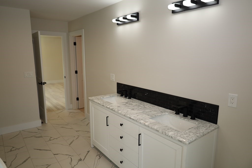 109 North Road Westfield, MA 01085 - Photo 36 of 41 a bathroom with a granite countertop sink and a mirror