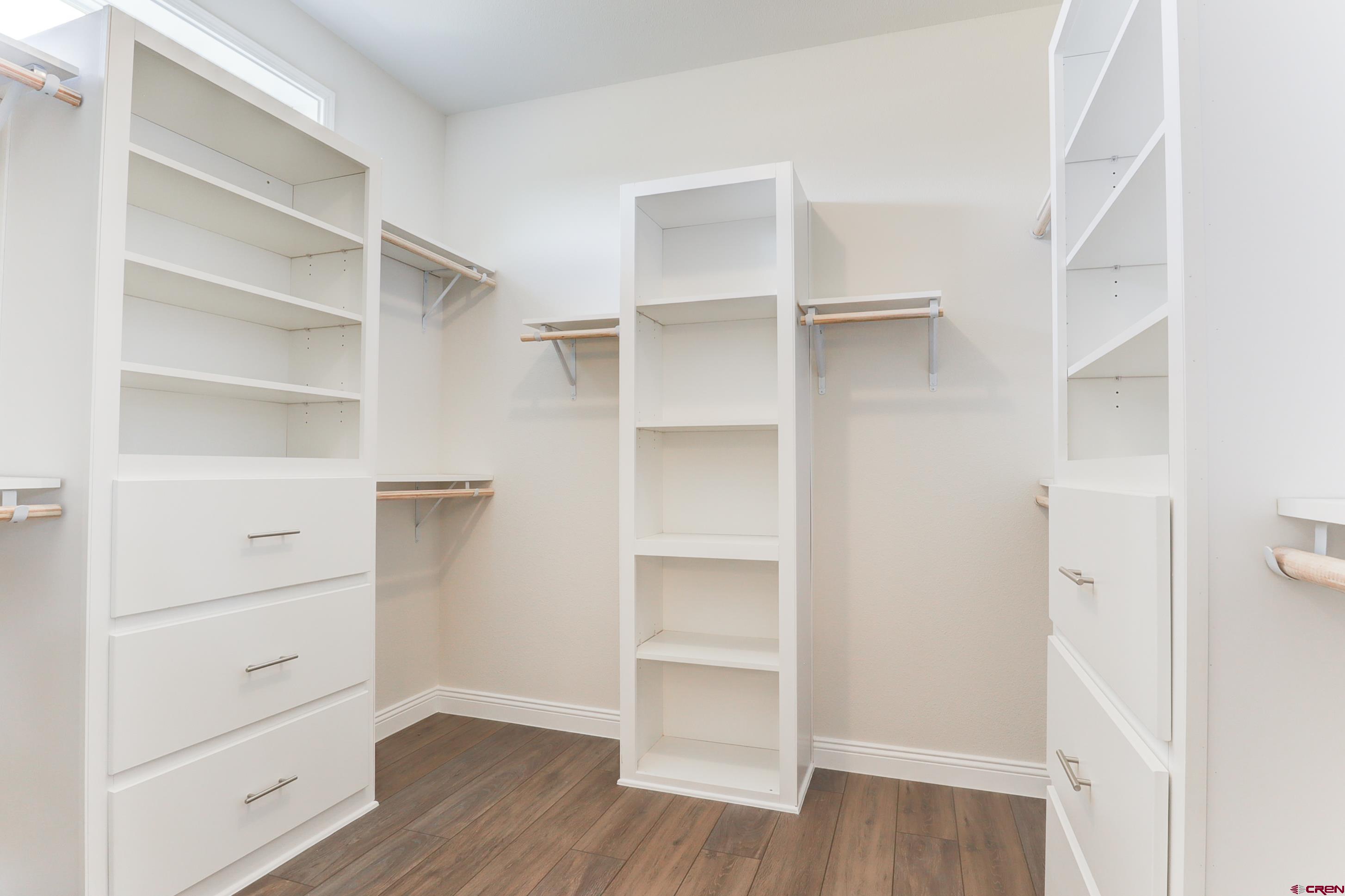 22667 Rd L Cortez, CO 81321 - Photo 16 of 35 a view of walk in closet with empty racks