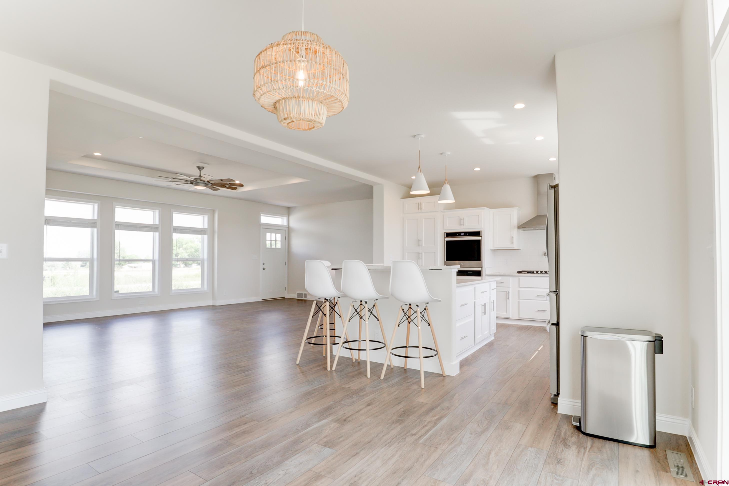 22667 Rd L Cortez, CO 81321 - Photo 17 of 35 a view of a dining room with furniture and wooden floor