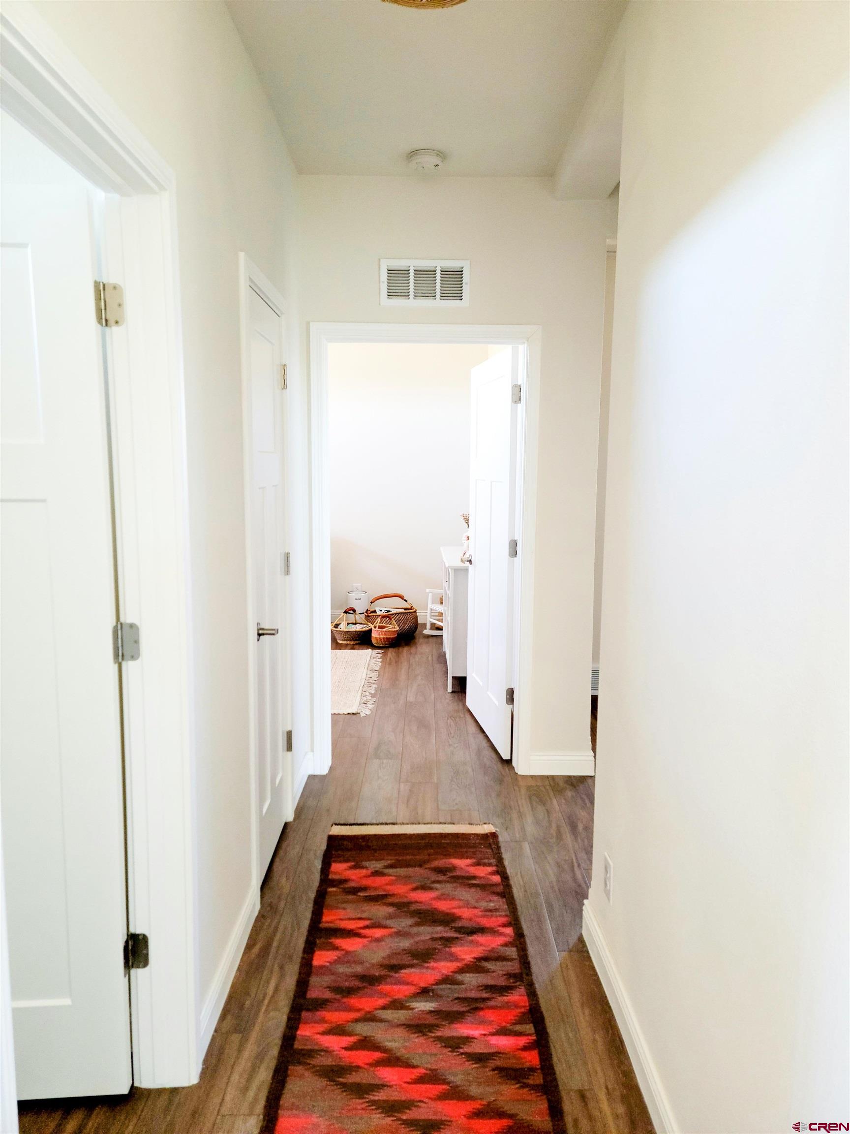 22667 Rd L Cortez, CO 81321 - Photo 18 of 35 a view of hallway with wooden floor