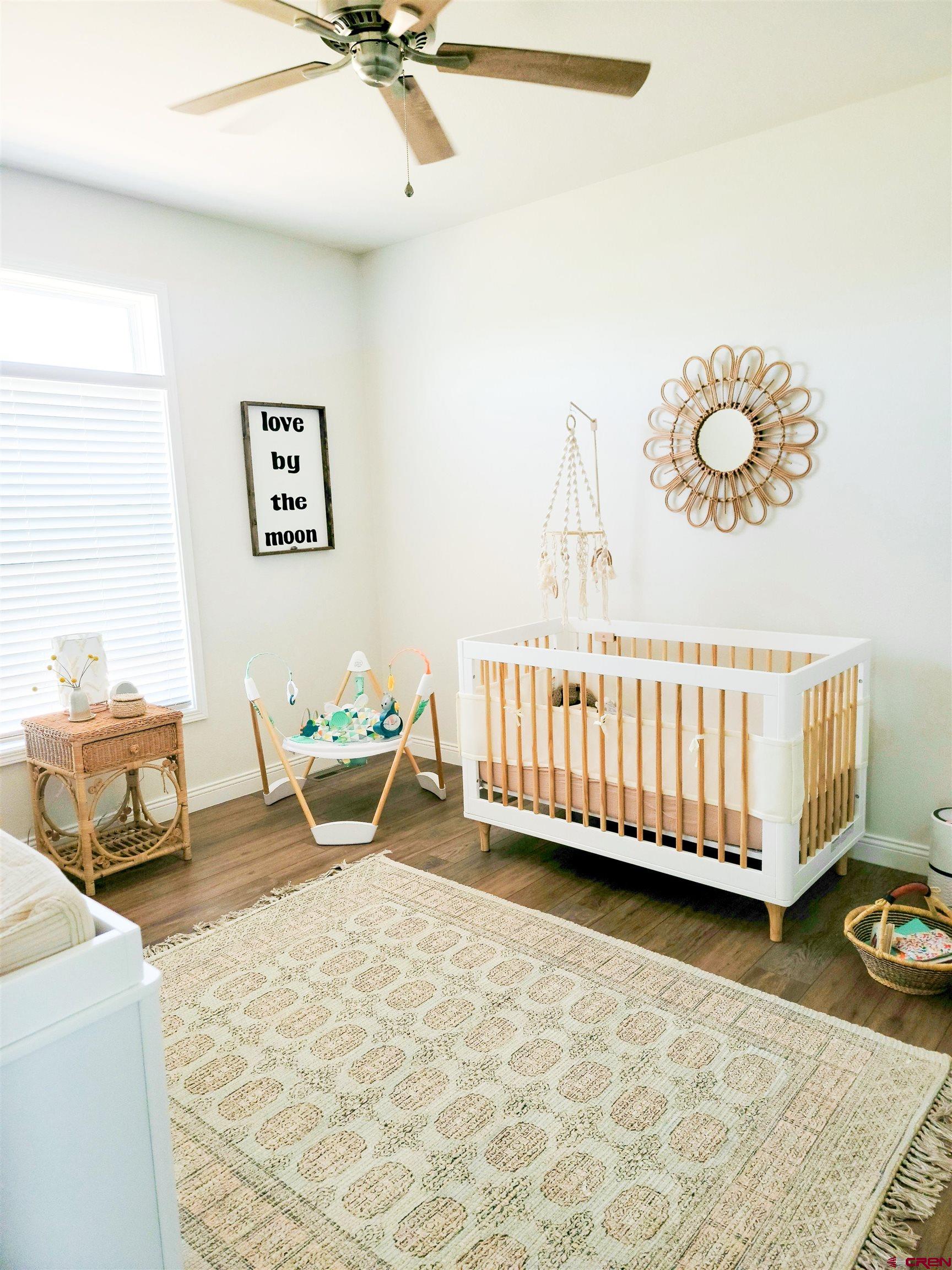 22667 Rd L Cortez, CO 81321 - Photo 21 of 35 a bed room with a bed and a couch