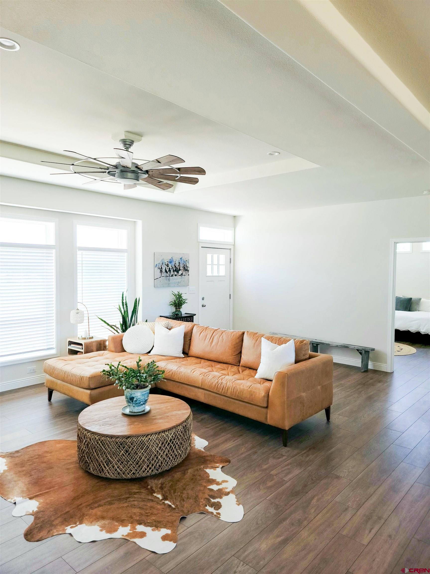22667 Rd L Cortez, CO 81321 - Photo 3 of 35 a living room with furniture and a chandelier
