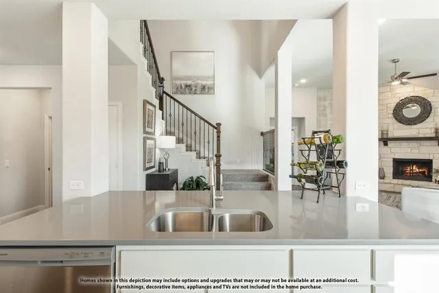 a view of living room with furniture and fireplace