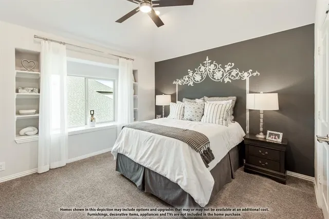 a spacious bedroom with a bed and a chandelier