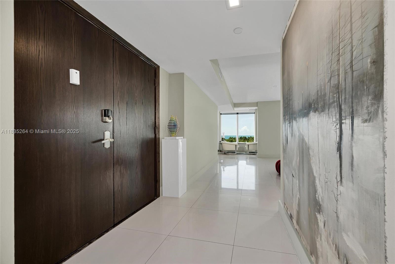 607 Ocean Drive, Unit 8K Key Biscayne, FL 33149 - Photo 1 of 8 a bathroom with a glass door shower