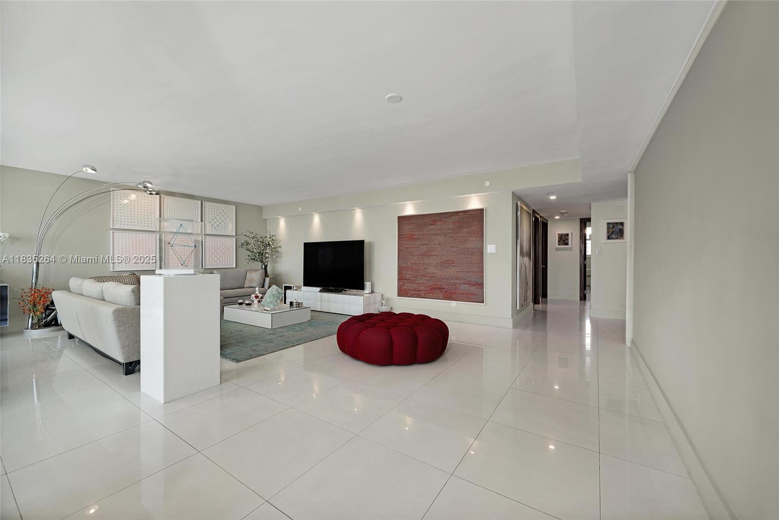 607 Ocean Drive, Unit 8K Key Biscayne, FL 33149 - Photo 2 of 8 a living room with furniture and a table