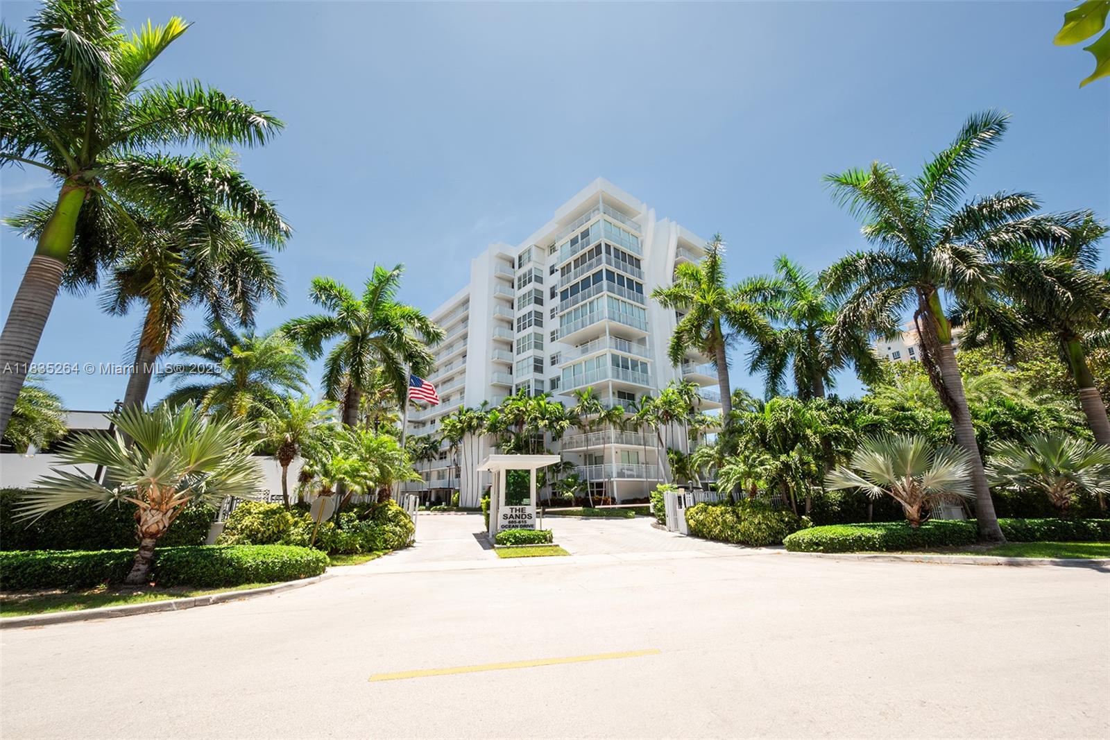 607 Ocean Drive, Unit 8K Key Biscayne, FL 33149 - Photo 8 of 8 a view of a garden with a potted plants