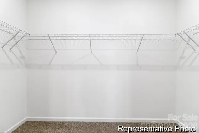 a bathroom with a sink a mirror and vanity