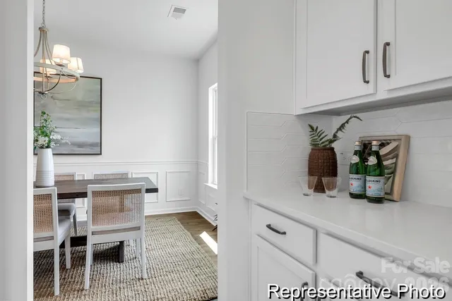 a view living room with wooden floor and potted plant