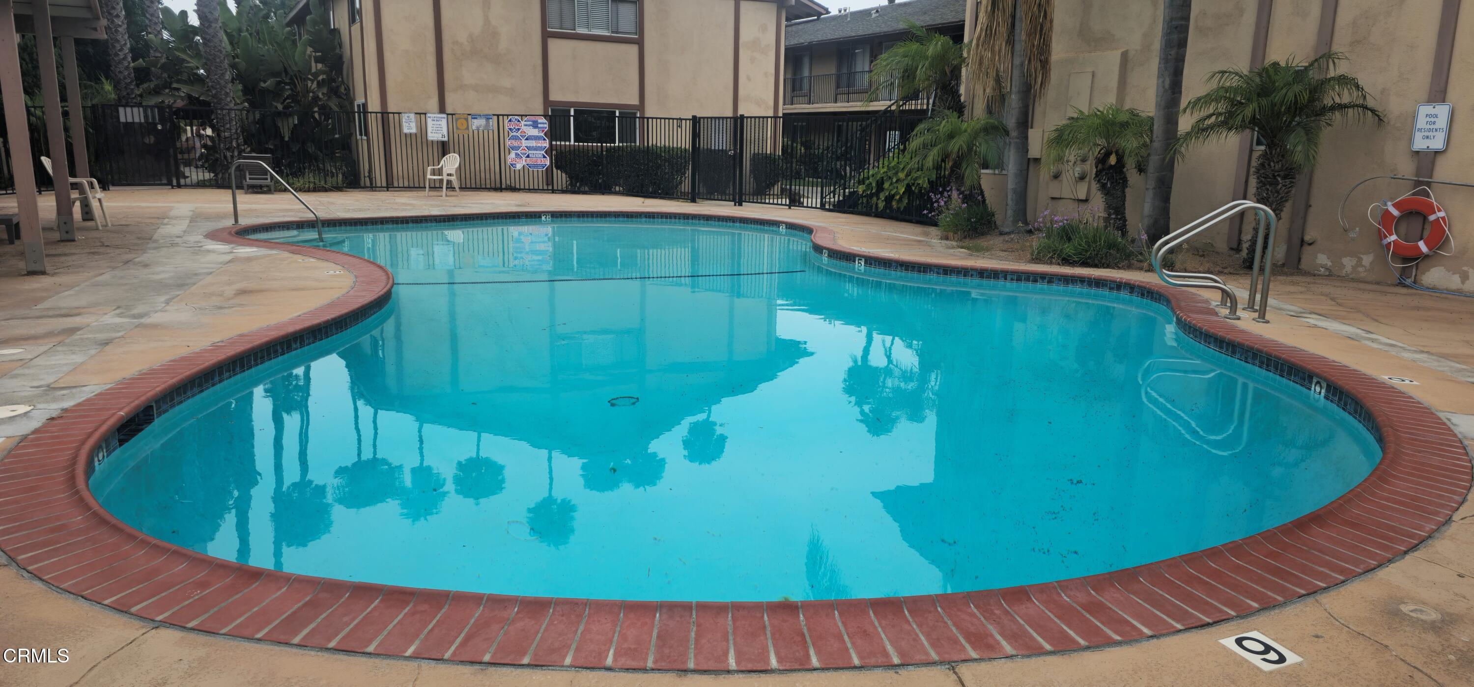 1925 Ginger Street, Unit 202 Oxnard, CA 93036 - Photo 2 of 6 a view of a swimming pool with a patio